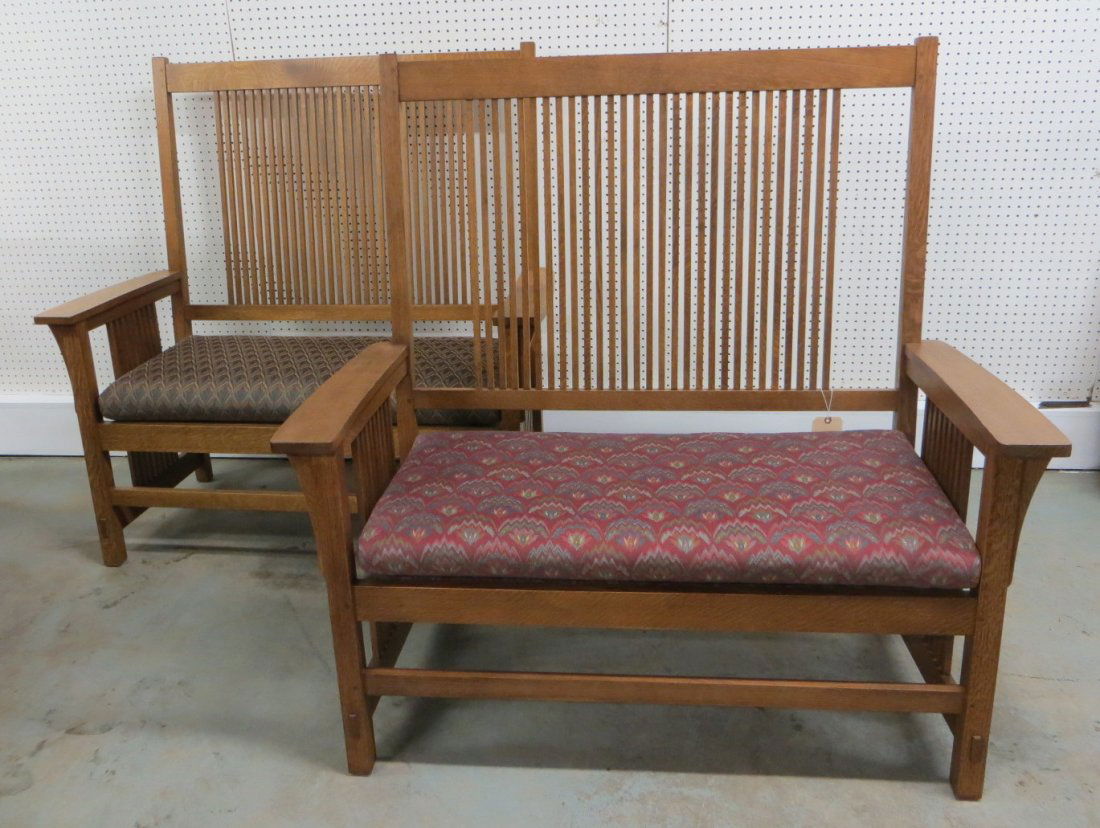 Pair of Mission oak high back settees - late 20th c.: Pair of matching contemporary Mission oak high back settees with small slats on back and under arms, one signed Stickley, Manlius NY. All mortise and tenon construction and both in excellent condition