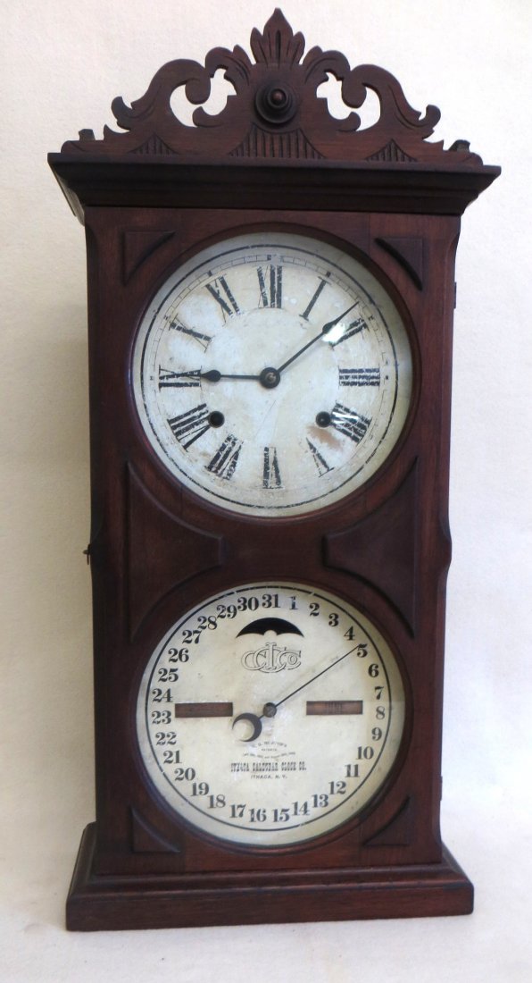 Ithaca black walnut calendar clock signed Ithaca: Ithaca black walnut calendar clock signed Ithaca Calendar Clock Co., Ithaca NY, pat. 1866 - all original. - comes with key and pendulum. Original paper label on back. 25.25"H.