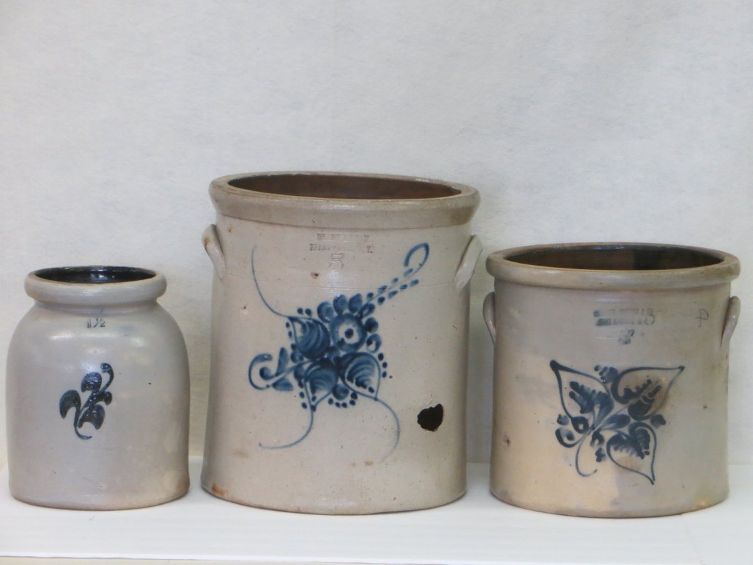 Three stoneware crocks including 5 gallon signed Brady: Three stoneware crocks including 5 gallon signed Brady & Ryan Ellenville NY with large blue flower - 2" x 1" hole in side with extending hairline; 1 1/2 gallon pantry jar with blue flower - tiny rim c