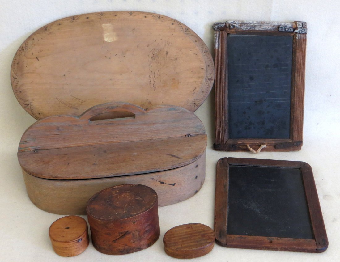 Collection of 7 country items including cutlery box: Collection of 7 country items including cutlery box with double lid, 2 early slate boards, 3 miniature oval boxes (one with hand drawn face on bottom), and an oval bread board with decorated edging. A