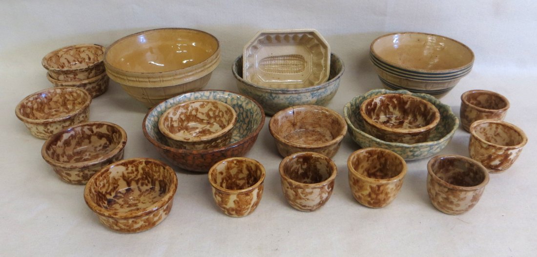 Collection of 19 pieces of country pottery including 3: Collection of 19 pieces of country pottery including 3 blue/green sponge decorated mixing bowls, 13 pieces of Bennington sponge decorated pottery, a yellowware corn mold, and 2 yellowware mixing bowls