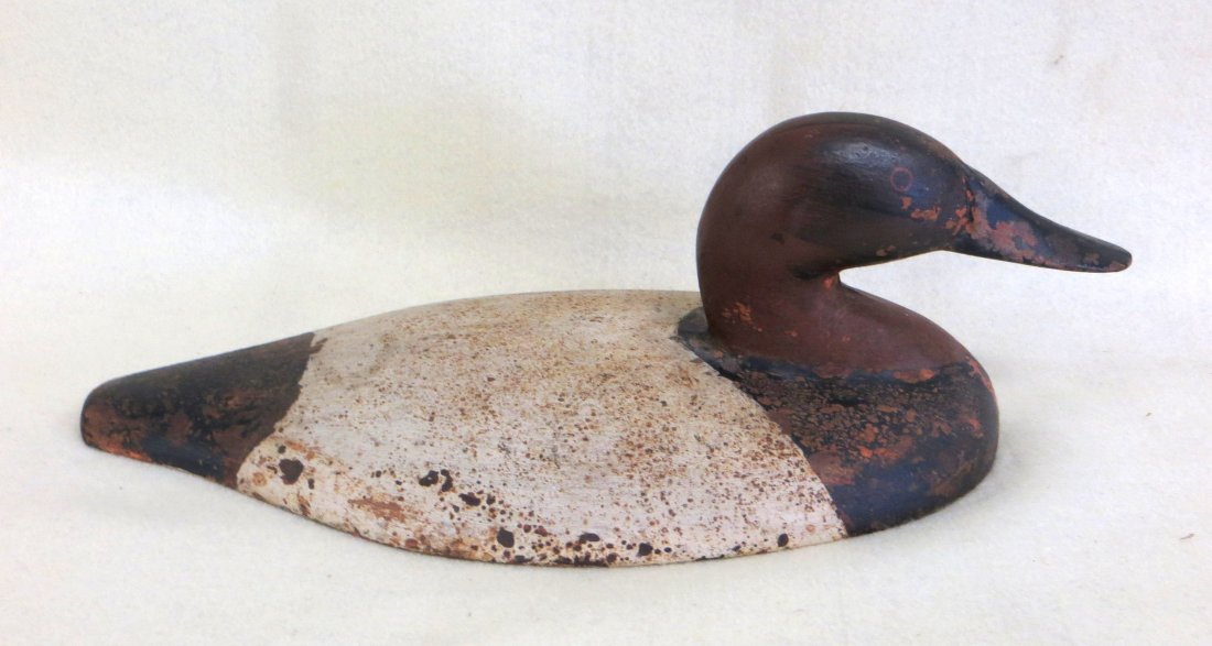 Sink box cast iron canvas-back decoy in old original: Sink box cast iron canvas-back decoy in old original old paint. 12.5"L. Minor paint loss, overall very good condition.