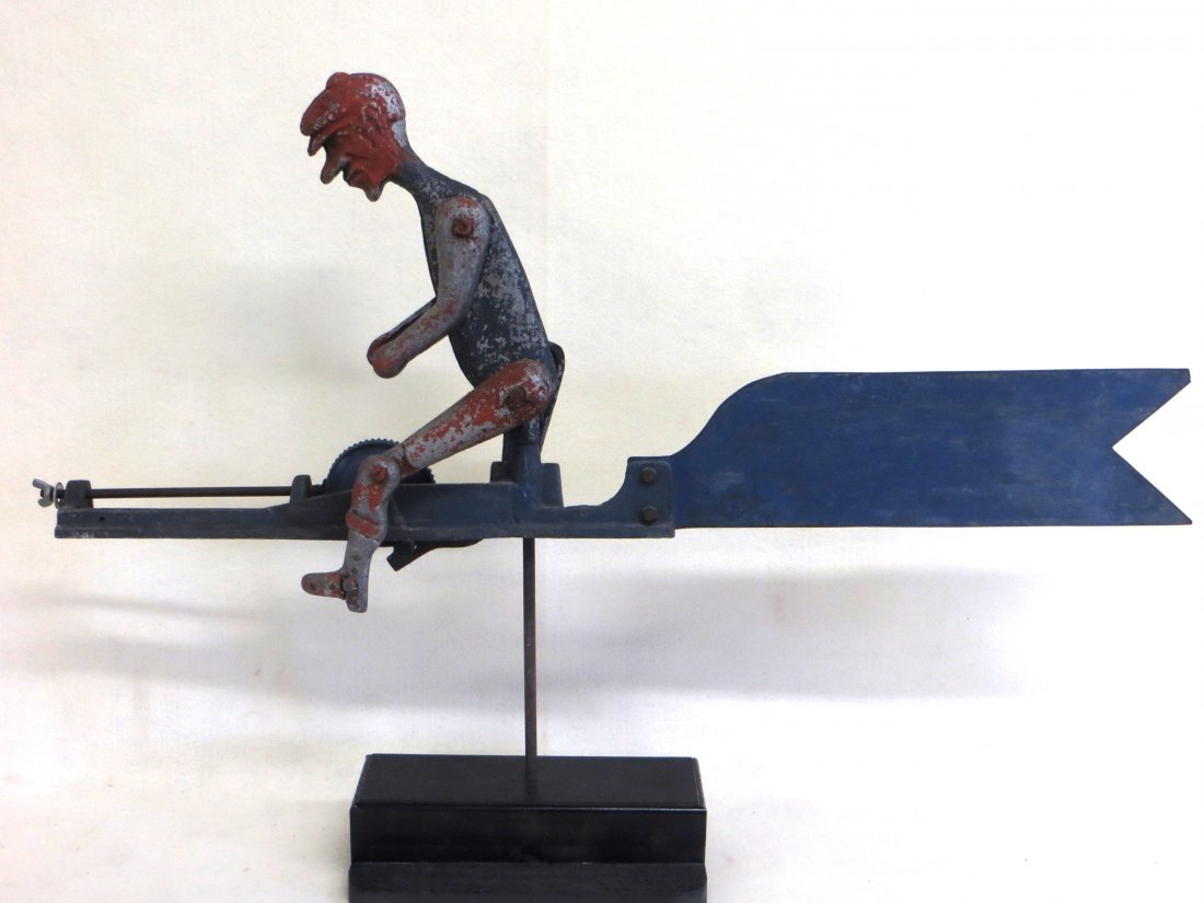 Folk art whirligig constructed of sheet and cast metal: Folk art whirligig constructed of sheet and cast metal depicting a seated man peddling a drive that runs a propeller - original paint - probably early 20th century. Missing propeller, crack on one foo
