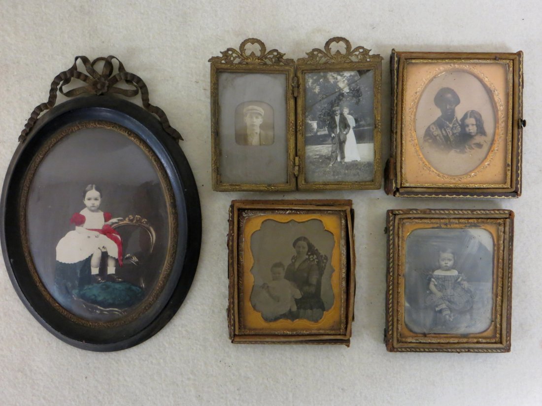 Collection of mostly cased photographs including: Collection of mostly cased photographs including daguerreotype of a child, photo of young girl with nanny, ambrotype of lady with child, ornate double frame with miniature family photos, and a 19th ce