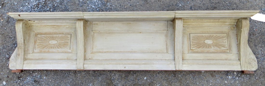 Architectural over mantle shelf unit with hand carved: Architectural over mantle shelf unit with hand carved wooden panels in old paint. 71"L x 7"D x 18"H. Mid-19th century. Good condition.