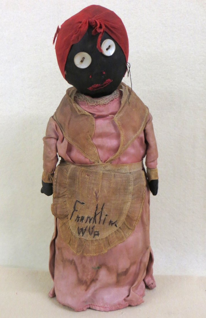 Old cloth Aunt Jemima souvenir doll from Franklin W.: Old cloth Aunt Jemima souvenir doll from Franklin W. Va.(as sewn into apron). Original hand made doll clothes are sewn around an old tin can - button eyes - probably late 19th century - 11"H.
