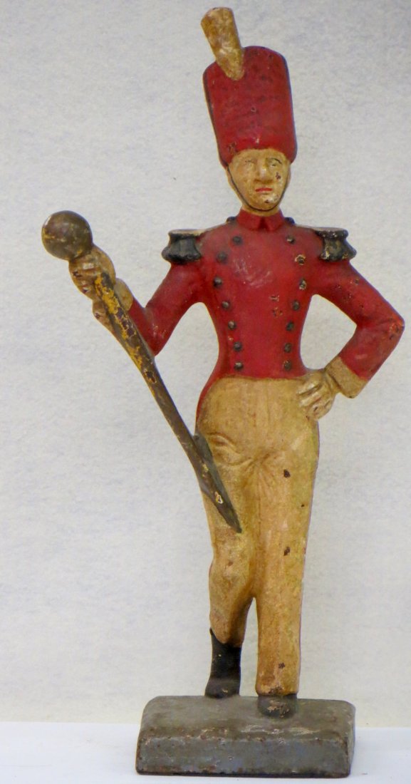 Cast iron doorstop of a full bodied Drum Major in: Cast iron doorstop of a full bodied Drum Major in original paint 12.75"H X 6" W