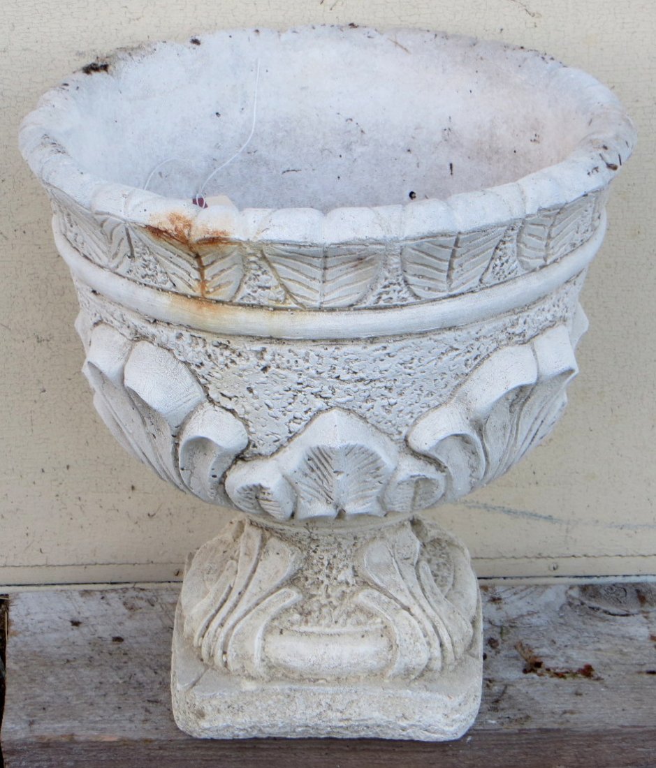 Concrete garden urn with acanthus decorations on base.: Concrete garden urn with acanthus decorations on base. 16"H. Good condition.