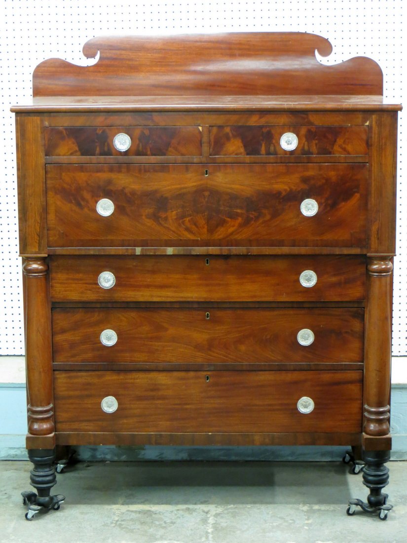 Beautiful cherry and mahogany late Sheraton chest of: Beautiful cherry and mahogany late Sheraton chest of drawers with backsplash, Sandwich glass pulls, turned columns, and turned feet - 51H x 20W x 46"L - excellent condition.