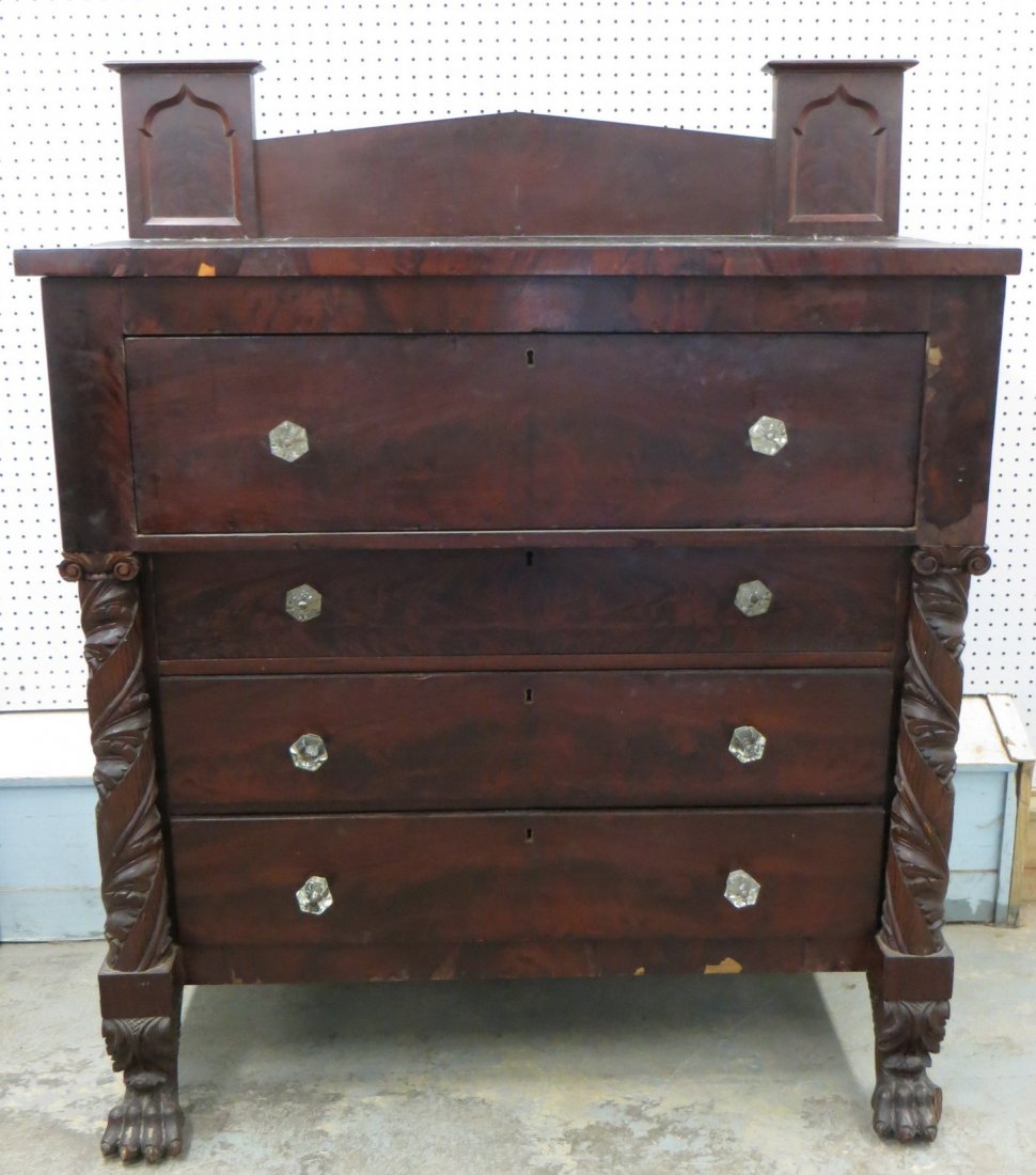 Empire mahogany chest with acanthus carved columns,: Empire mahogany chest with acanthus carved columns, claw feet, original gothic backsplash - some veneer losses as well as loss to toe on right foot.