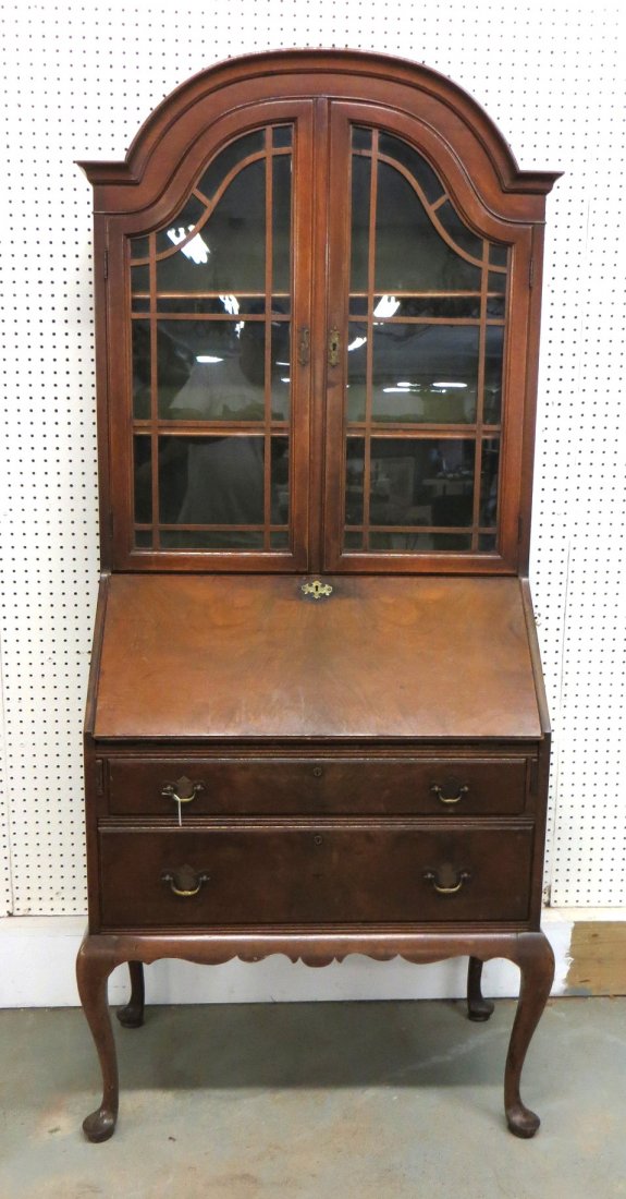 Queen Ann style mahogany secretary desk having 2 glass: Queen Ann style walnut secretary desk with burl panels having 2 glass doors over drop-front desk with fitted interior over 2 long drawers. Minor surface wear, support blocks missing from back 2 legs s