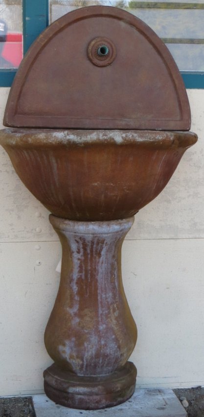 Wall mountable faux terra cotta (concrete) 3 section: Wall mountable faux terra cotta (concrete) 3 section water fountain. Plumbing hookup allows water to circulate between top fountain and basin. 55"H. Excellent condition.