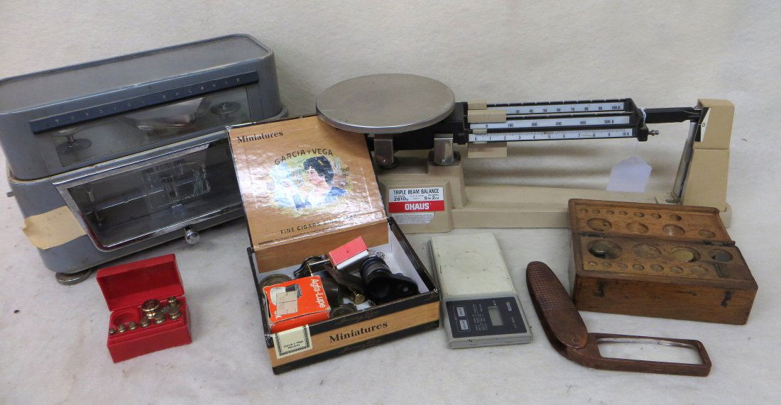 Grouping of jeweler's and coin dealer accessories: Grouping of jeweler's and coin dealer accessories including 2 balance scales (Torsion Balance by the Torsion Balance Co. and a triple beam balance scale by Ohaus), Tanita pocket scale, various weights