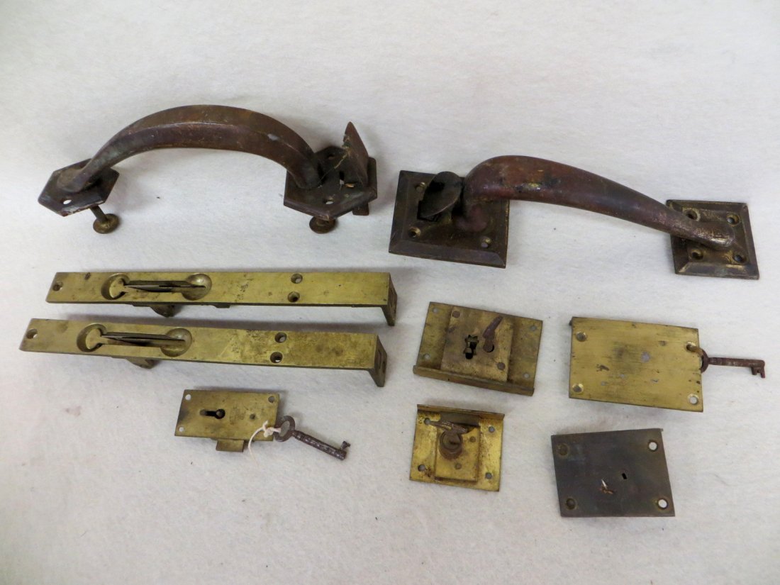 Collection of mostly brass hardware including 2 handles: Collection of mostly brass hardware including 2 handles - 9"H & 9.5"H, 2 brass French door releases and 5 small locks - 1.5" to 3"L.