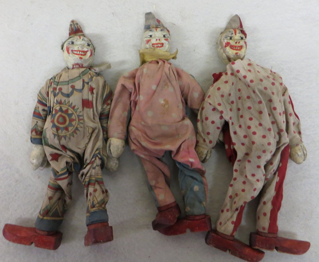 Lot of 3 vintage wooden Shoenhut clowns 8.25"H one: Lot of 3 vintage wooden Shoenhut clowns 8.25"H one needs repair to outfit and restringing to head. Outfits are in fair to good condition.
