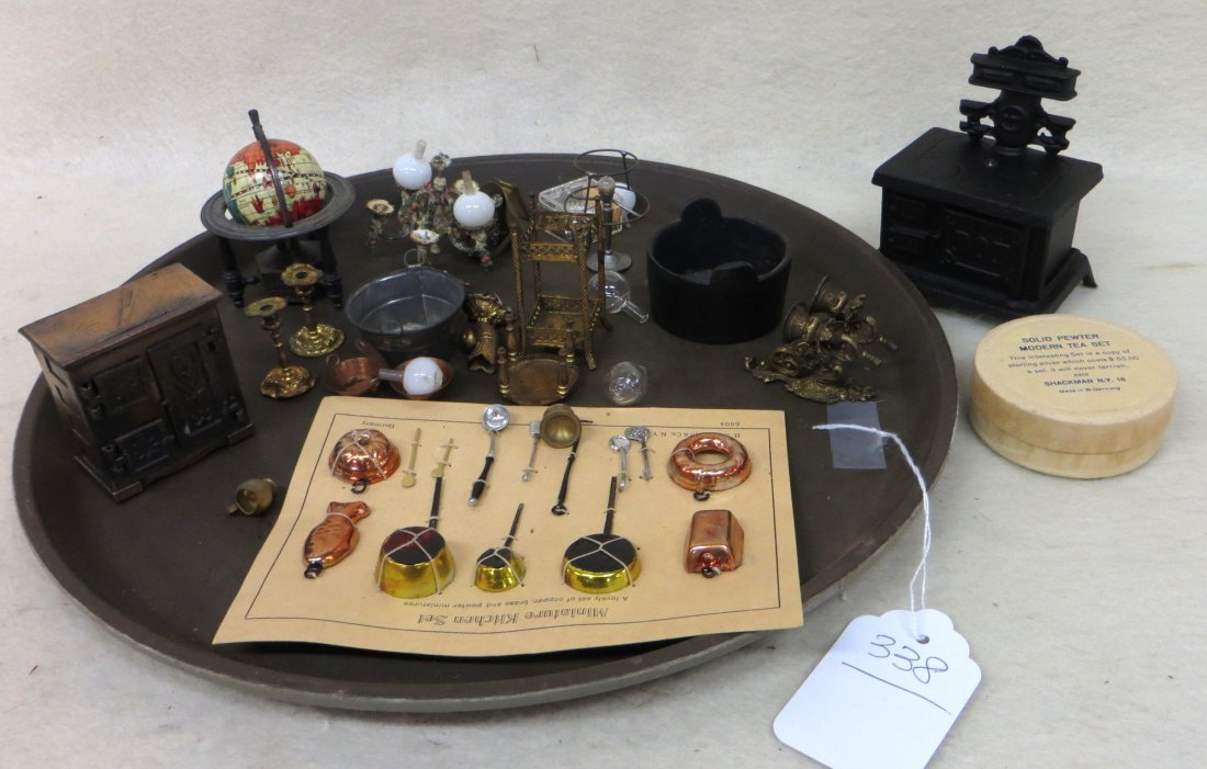 Dollhouse metal accessories lot including a solid: Dollhouse metal accessories lot including a "Miniature Kitchen Set" in various metals sold in NY and made in Germany still attached to original cardboard display; solid pewter "Modern Tea Set" in orig
