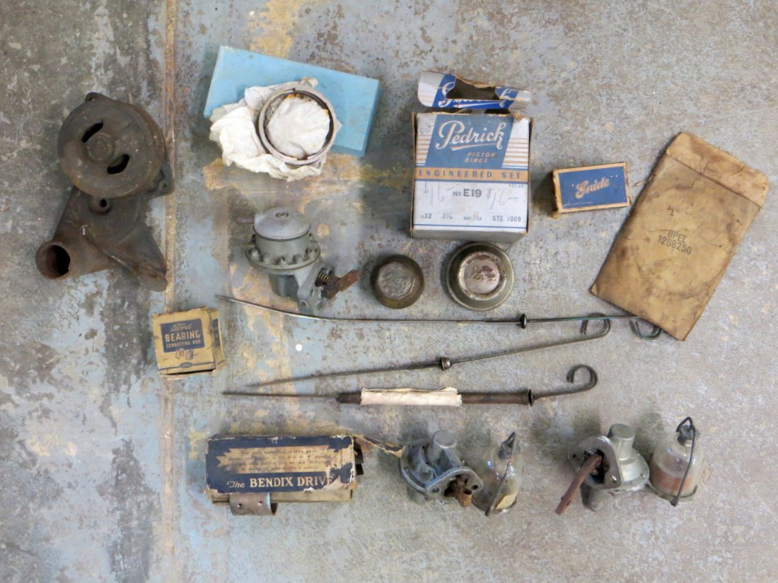 Ford motor parts.: Grouping of mostly old Ford Motor parts including rings, fuel filters, fuel pump, etc.