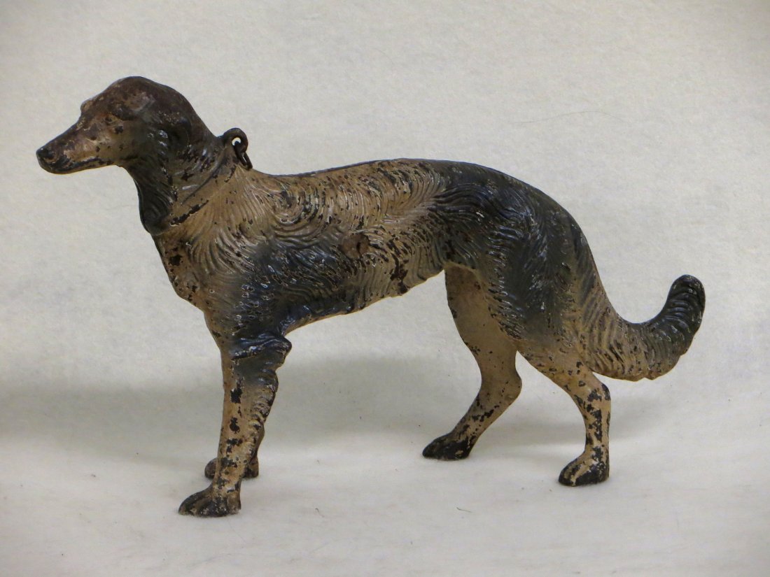 Cast iron wolfhound door stop in original black and: Cast iron wolfhound door stop in original black and white paint - good condition. 12.5"L x 7.75"H. Provenance: From the Ann Phillips collection, Verbank NY.