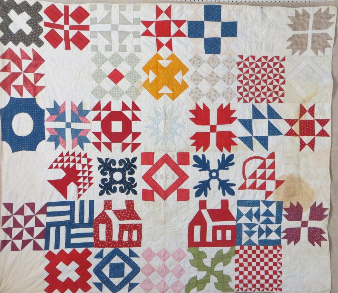 Sampler patchwork quilt with staining including brown: Sampler patchwork quilt with staining including brown stain & yellow stain on right side, other yellowing noticeable on front and reverse side - Fabric itself in excellent condition with vibrant color