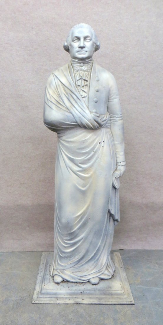 Cast iron George Washington dumb stove figure depicting: Cast iron George Washington dumb stove figure depicting a standing George Washington draped in cloak and holding a scrolled document in his left hand - 48"H x 14"W x 7"D - base plate 18.5" x 16.5". Ci
