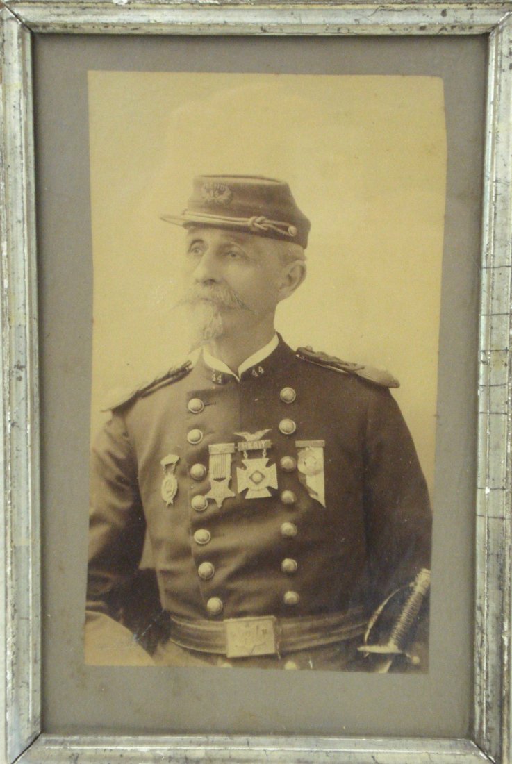 Photo of Civil War soldier in G.A.R. uniform - 44th: Photo of Civil War soldier in G.A.R. uniform - 44th regiment. Kepi and Merit badge marked "Reno". Photo 5" x 9.5" and in good condition.