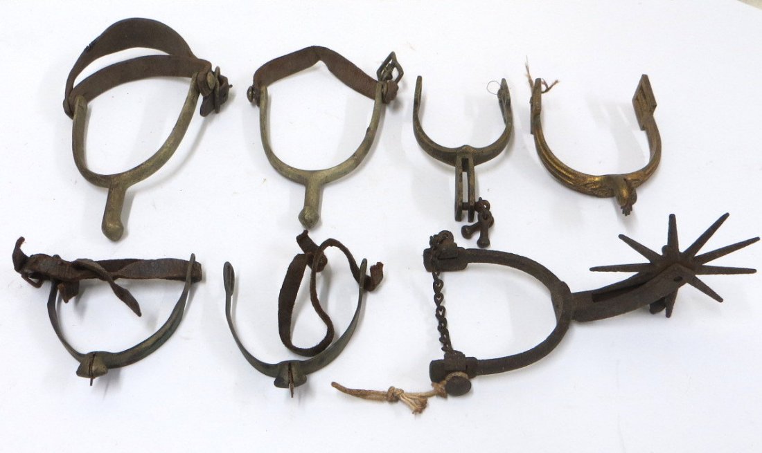 Seven old spurs including a pair of WWI military: Seven old spurs including a pair of WWI military cavalry type with original leather straps signed C.McD and US / A.B. ; pair of small cavalry spurs remnants of original leather but some losses to whee