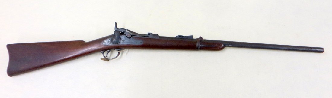 US Springfield Model 1873 trapdoor carbine rifle -: US Springfield Model 1873 trapdoor carbine rifle - serial No. 91750. Lock plate engraved with an eagle with a shield to its breast stamped US SPRINGFIELD. Breech block marked US Model/1873 - 24" barre