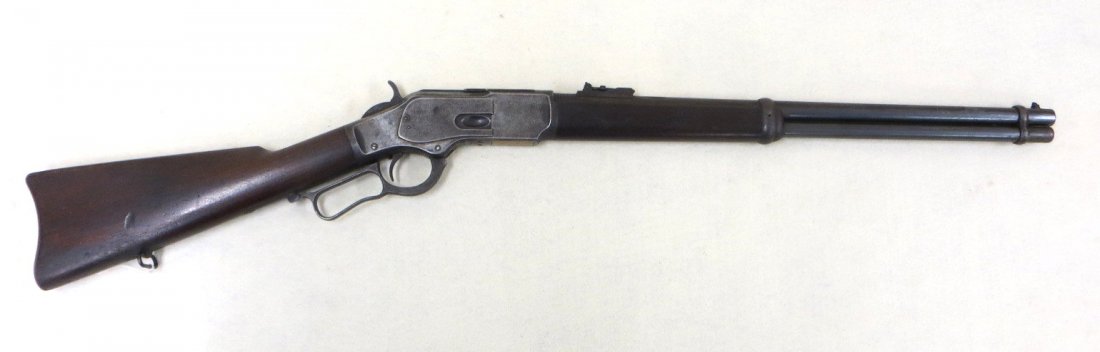 Winchester Model 1873 lever action 44-40 rifle,: Winchester Model 1873 lever action 44-40 rifle, manufactured in 1889. Signed "Winchester's-Repeating-Arms New Haven,CT / King's Improvement Patented - March 29, 1866. October 16, 1860". Serial number 