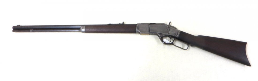 Winchester model 1873 lever action 32-40 rifle,: Winchester model 1873 lever action 32-40 rifle, manufactured in 1891. Blade front and adjustable rear sights. Signed "Winchester's-Repeating-Arms New Haven,CT / King's - Improvement - Patented - March