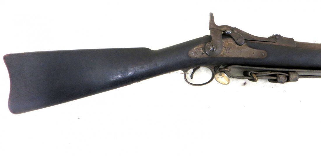 US Springfield Model 1884 Trapdoor Rifle 45-70. Serial: US Springfield Model 1884 Trapdoor Rifle 45-70. Serial number 552457. The lock plate engraved with an eagle with shield to its breast and stamped US SPRINGFIELD - barrel is 32.5" with a fixed front an