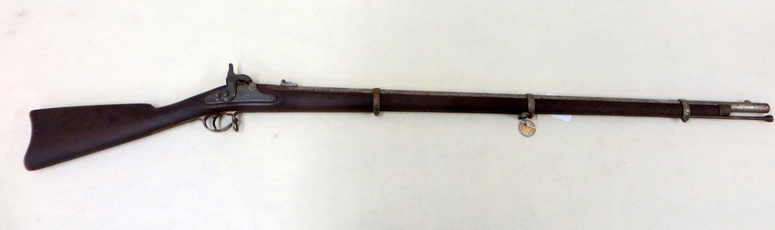 US Springfield Model 1863 Percussion Rifle. The lock: US Springfield Model 1863 Percussion Rifle. The lock plate engraved with an eagle with shield to its breast and stamped 1863 US SPRINGFIELD; 40”L round barrel with front sight, steel trigger guard w