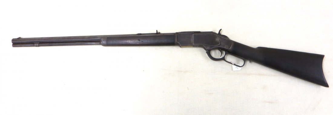 Winchester Model 1873 lever action 32-40 rifle,: Winchester Model 1873 lever action 32-40 rifle, manufactured in 1890. Blade front and adjustable rear sights. Signed "Winchester's-Repeating-Arms New Haven,CT / King's Improvement Patented - March 29,
