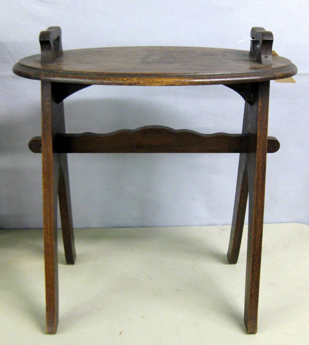 Small Val-kill Hyde Park NY oak serving table having 2: Small Val-kill Hyde Park NY oak serving table having 2 wooden handles attached to oval top and lower cross stretcher, circa 1930-50. 24"L x 15.5"W x 25.5"H. Stamped signature "VALKILL HYDE PARK N Y". 