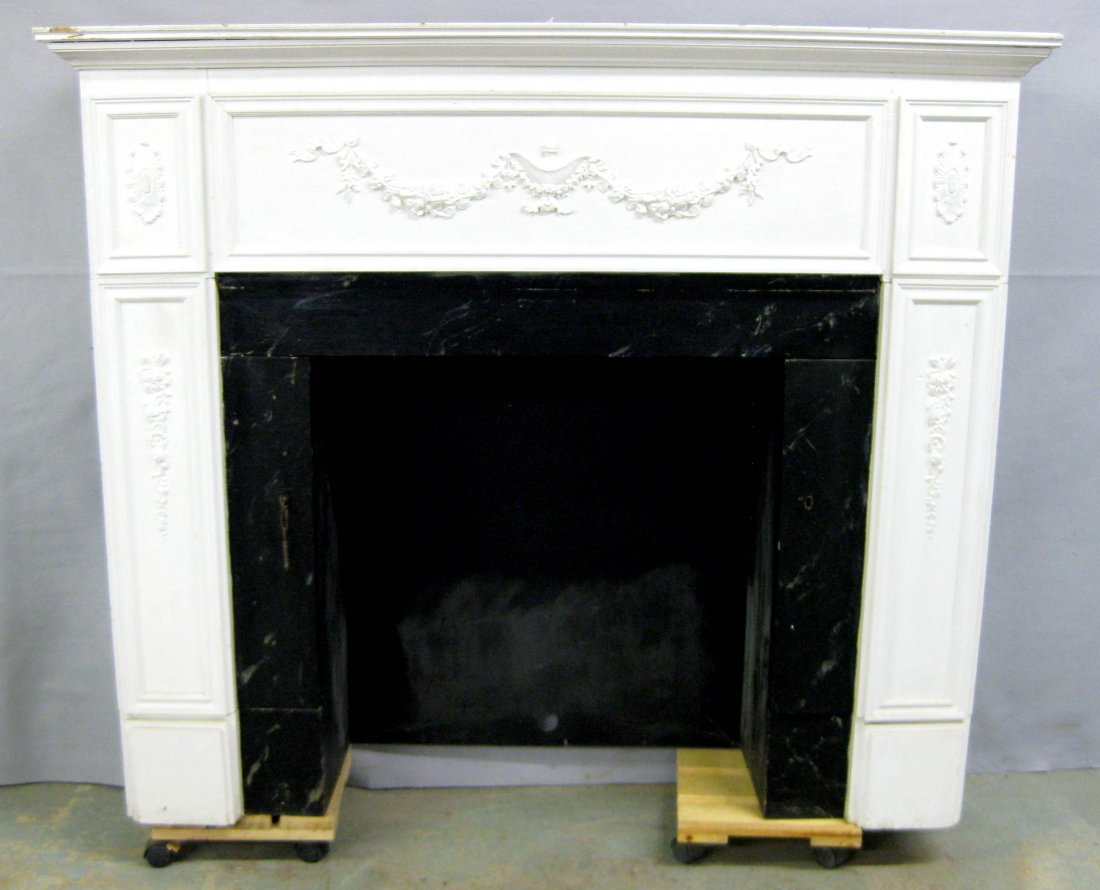 Faux fireplace mantel with built-in bar exposed by: Faux fireplace mantel with built-in bar exposed by opening upper door panel, 2 storage areas on front-side legs (doors are front of legs), and built in radio which is hidden on right side panel behind