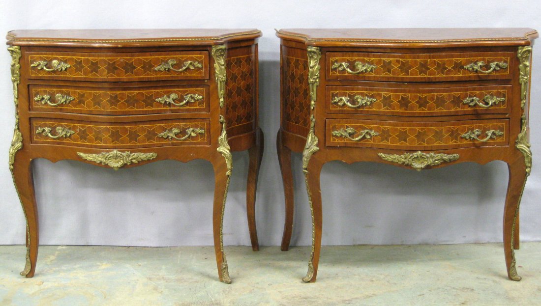 Two French style serpentine front console tables with 3: Two French style serpentine front console tables with 3 drawers and fancy brass pulls and ormolu - extensive star inlay on top, sides and front - 32"L x 15"D x 28.5"H. Both in very good condition with