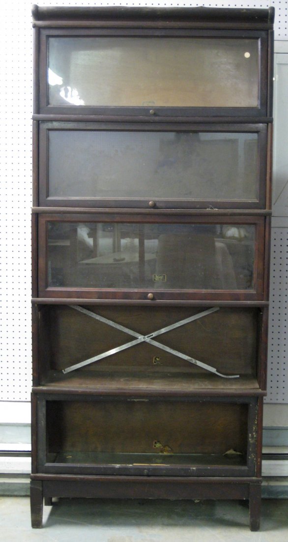 Five section stacking mahogany bookcase signed Hale -: Five section stacking mahogany bookcase signed Hale - one door detached and glass from one door missing. Top with veneer damage, otherwise fair to good condition.