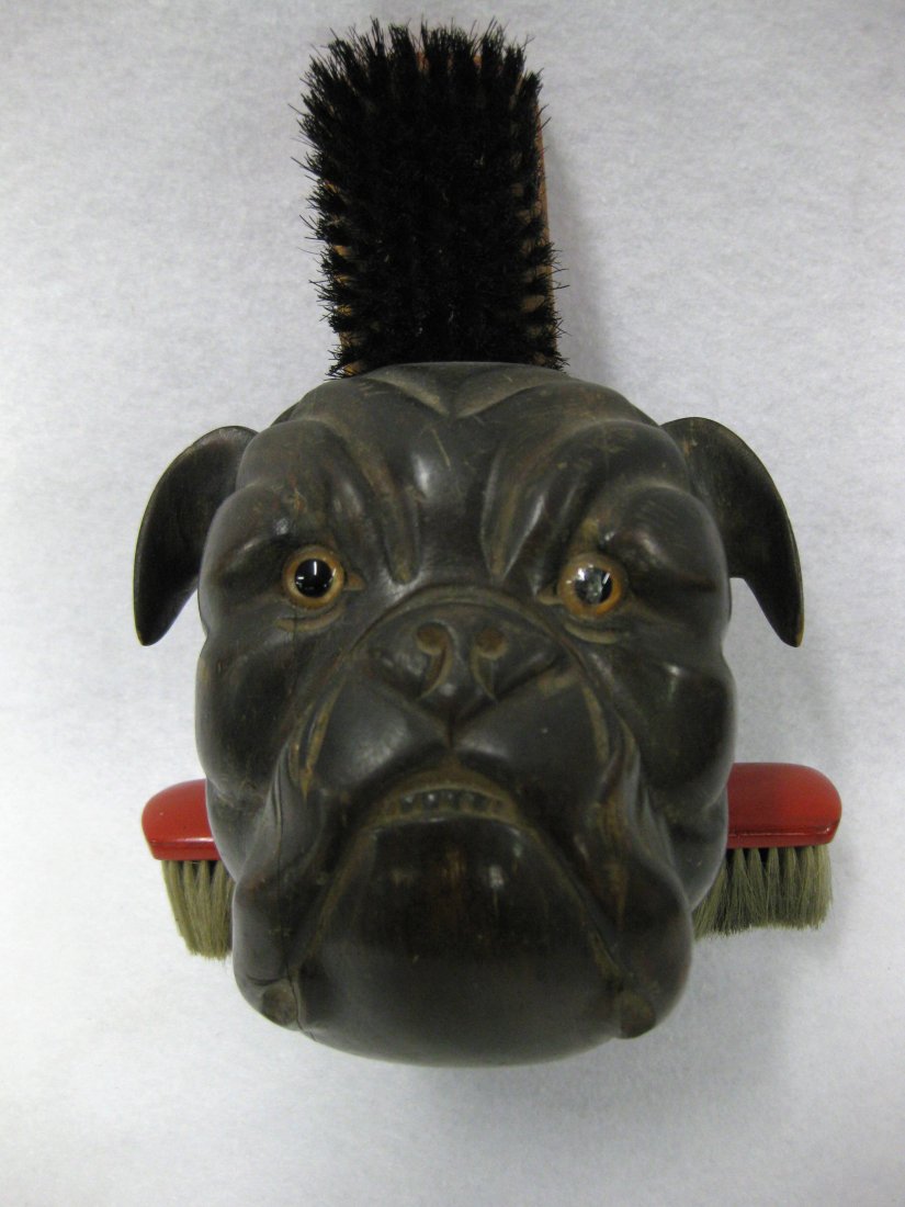 Hand carved wooden bull dog form brush holder - bull: Hand carved wooden bull dog form brush holder - bull dog in original dark brown finish with glass eyes - brush holder in rear of dog's head and through his/her neck. Approximately 6"D x 6"H x 5.5"W. O
