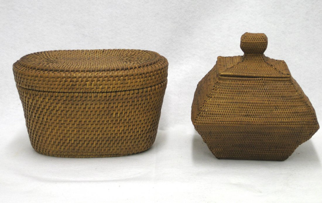 Two woven river cane sewing/storage baskets with lids,: Two woven river cane sewing/storage baskets with lids, probably Inuit. One oval shape 5.5"H x 9"L x 6.25"W, the other architectural in appearance, 7"square at center x 6.5"H. Both excellent condition.