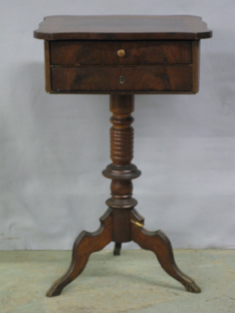 Victorian mahogany 2 drawer sewing stand on pedestal: Victorian mahogany 2 drawer sewing stand on pedestal base - top with crotch mahogany inlay - top drawer with sewing compartments with losses. One leg with repair. Late 19th century.