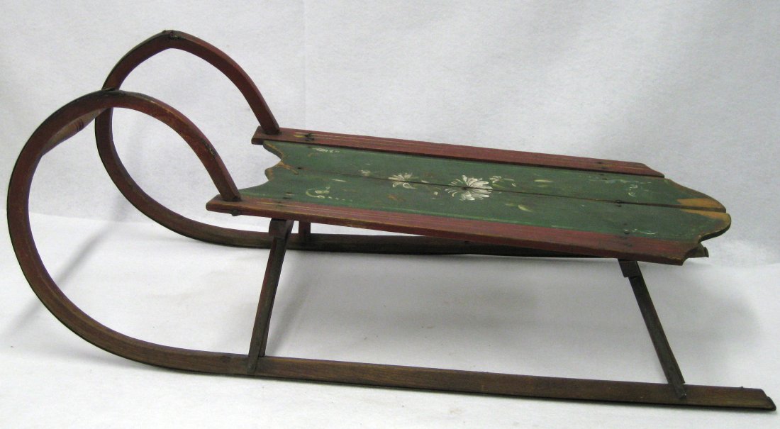 Early hand painted child's sled decorated with a hand: Early hand painted child's sled decorated with a hand painted flower and stenciling - all original - shrinkage crack down center otherwise good condition. 34"L.