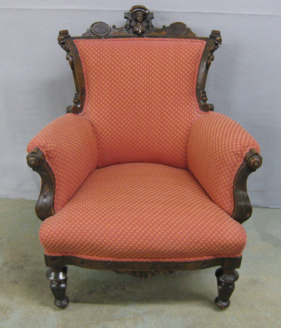 Eastlake Victorian upholstered black walnut ladies: Eastlake Victorian upholstered black walnut ladies chair with carved figure of a woman on top crest in the manner of John Jelliff. Missing small section of turning on left front foot and minor veneer