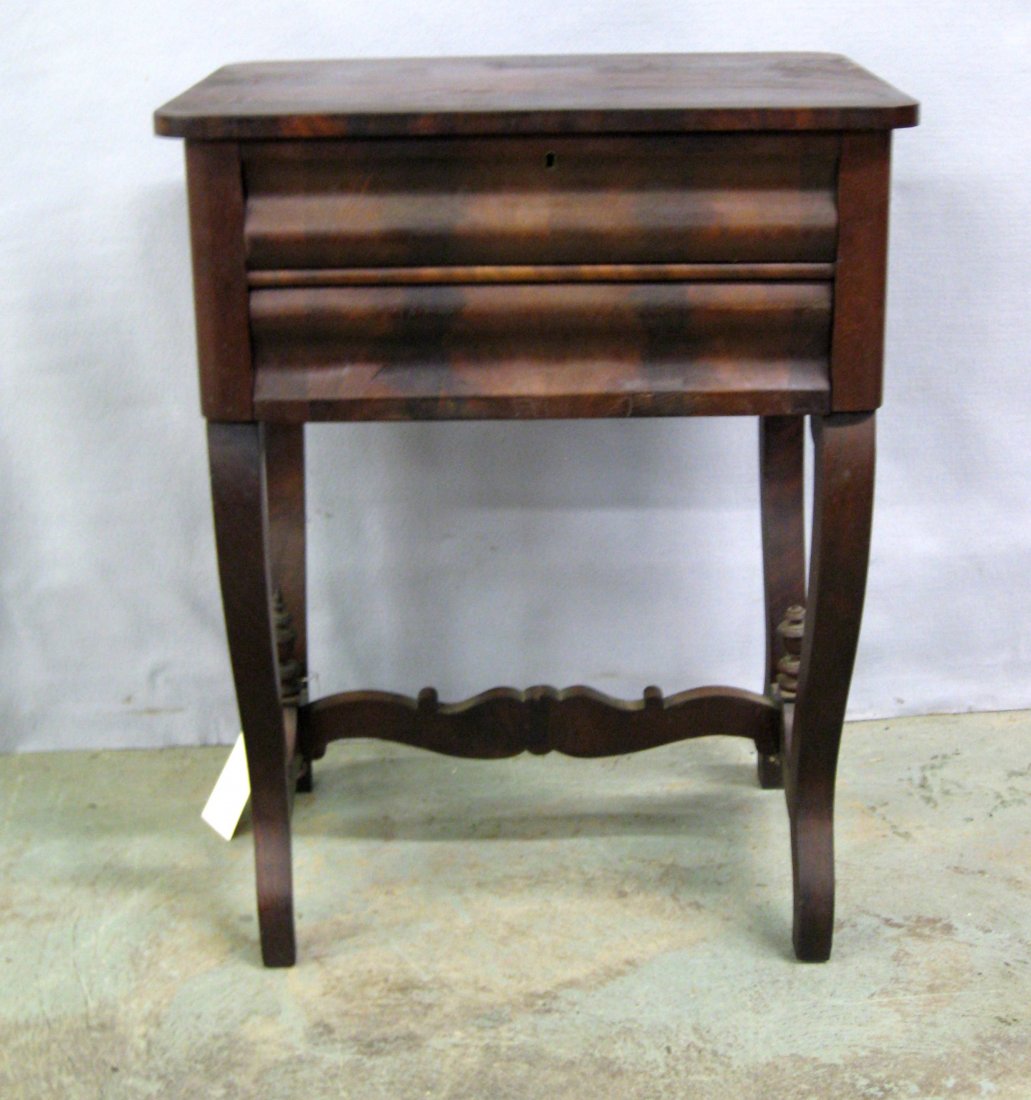 Mahogany Empire 2 drawer sewing stand with ogee drawers: Mahogany Empire 2 drawer sewing stand with ogee drawers and inlaid crotch mahogany top. Mid-19th century. Good condition.