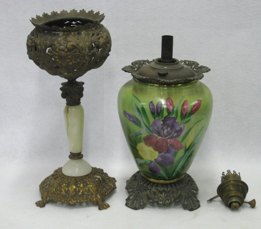 Two fancy Victorian oil lamp bases including one with: Two fancy Victorian oil lamp bases including one with an ornate brass holder over an alabaster pedestal and the other with a colorful hand painted picture of flowers on porcelain base - includes keros