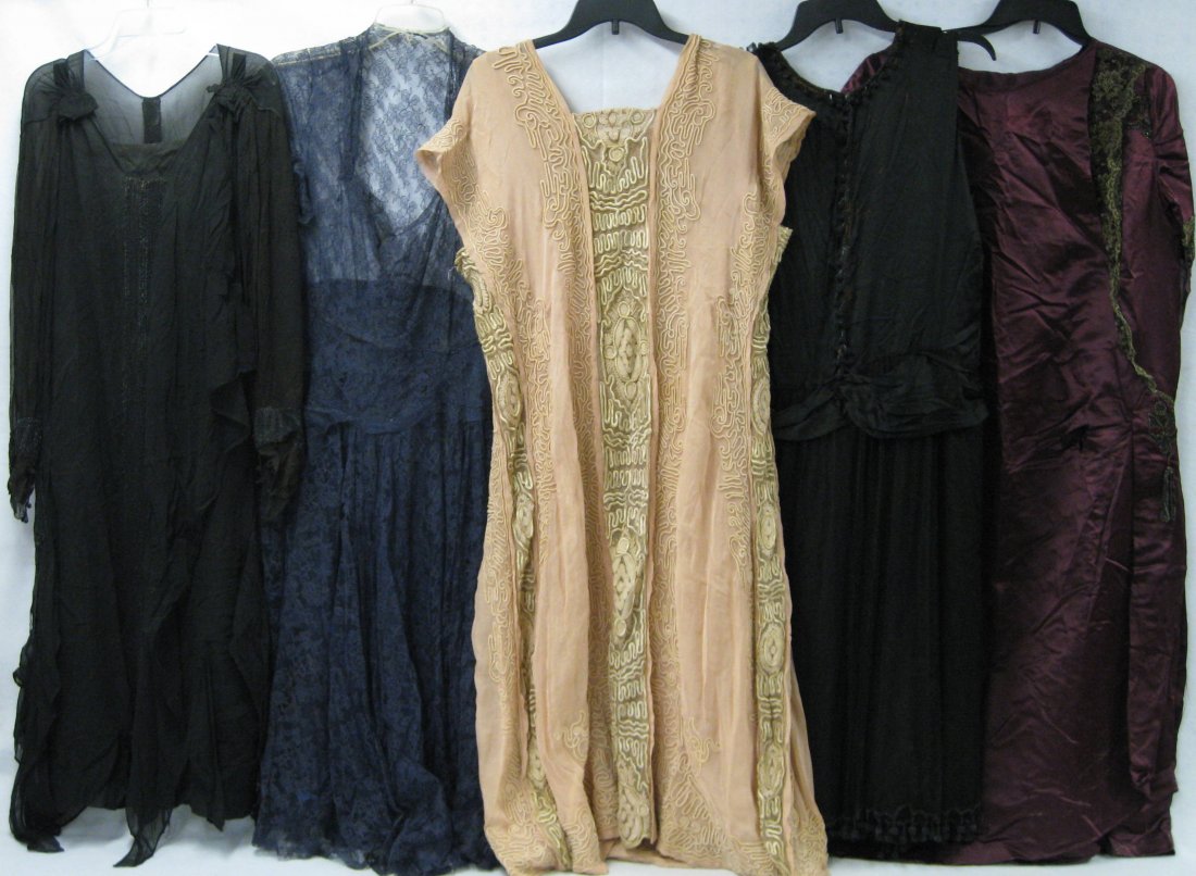 Five Edwardian and flapper era dresses: Five Edwardian and flapper era dresses in lace, satin and possibly silk, 3 with mostly black bead work. One in navy blue colored lace with no undergarment - several breaks in lace. The maroon satin dr