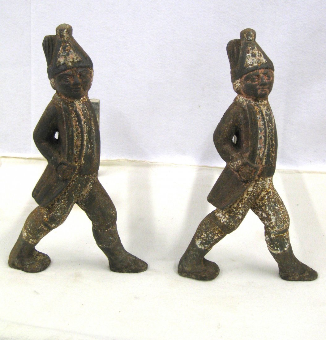 Pair of cast iron Hessian soldier andirons in full,: Pair of cast iron Hessian soldier andirons in full, heavy casting, early 19th century with traces of old paint. removable fire dogs dovetail into backs of figures. Some light surface rust, otherwise v