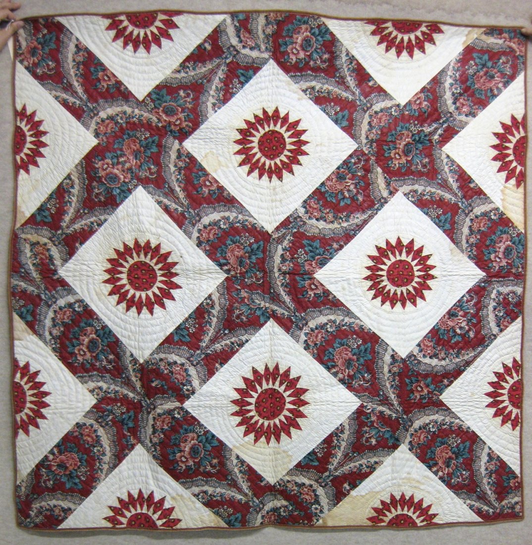 Chintz crib quilt with a compass pattern - 19th century: Chintz crib quilt with a compass pattern - 19th century - 50" x 50" - original printed fabric backing decorated with flowers & birds. Noticeable staining. Provenance: Found in the old Van Benschoten F