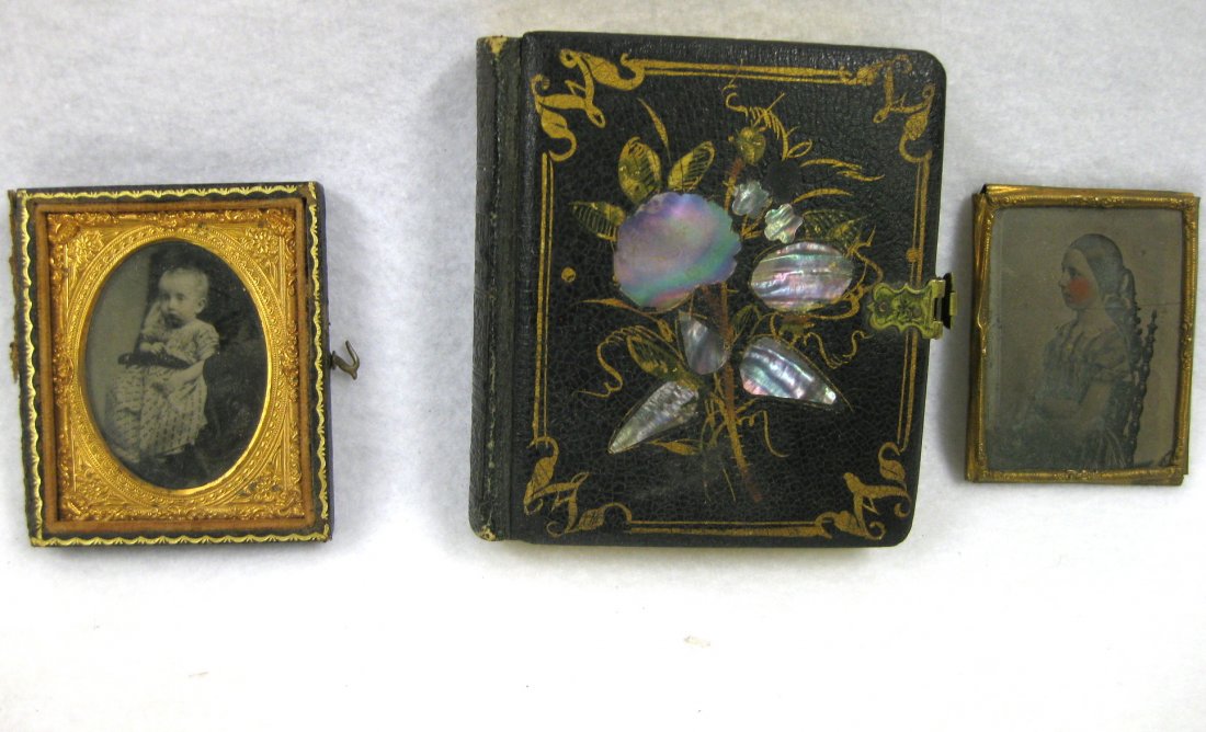 Grouping of 3 old cased photos including a: Grouping of 3 old cased photos including a Daguerreotype double photo of man and woman in a mother of pearl case (one small area of case where pearl is missing), ambrotype (not examined out of case) o