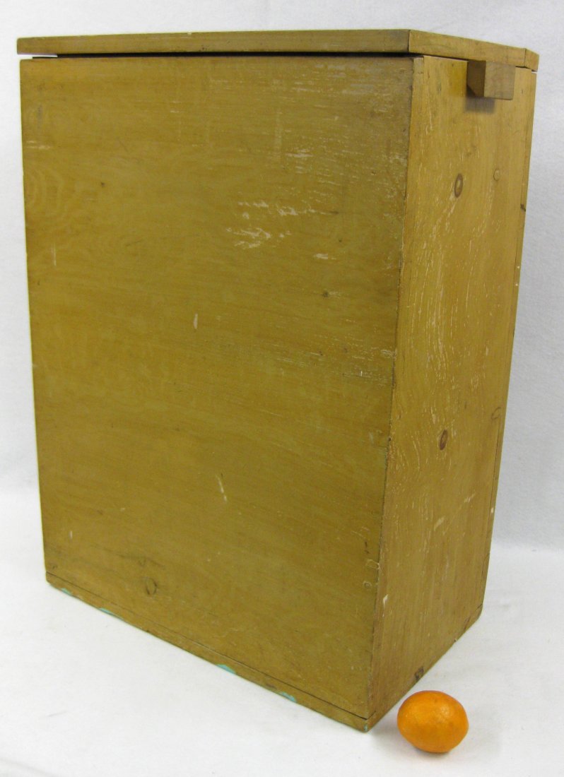 Good 19th century lift top grain box in original: Good 19th century lift top grain box in original mustard grain paint with attached wooden side handles. 31.5"H x 22.75"W x 14"D. Minor paint loss, overall very good original condition.