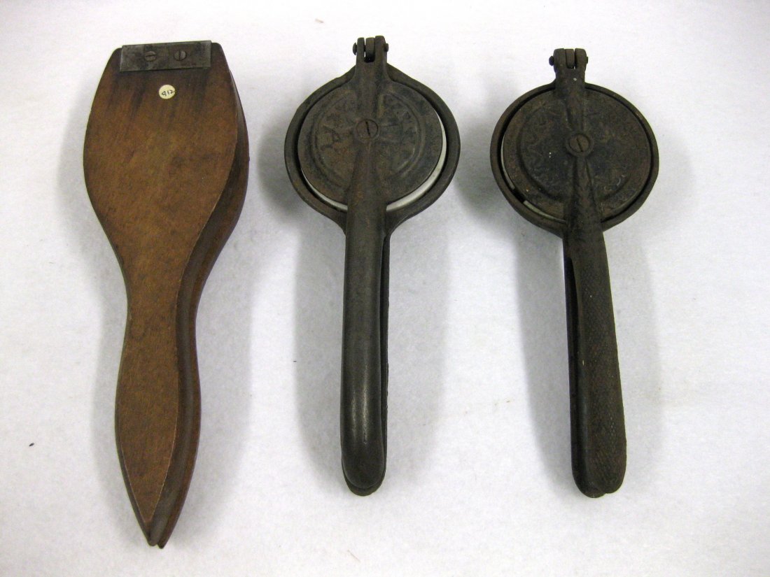 Three old lemon squeezers, all with porcelain inserts,: Three old lemon squeezers, all with porcelain inserts, including 1 in wood and 2 in cast iron (one with patent date 1868). All in good condition. Provenance: From the estate of Elliott Steckel, Sharon