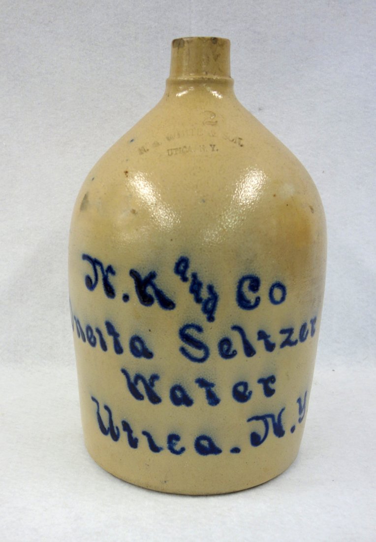 Stoneware 2 gal. advertising script jut signed "N. K: Stoneware 2 gal. advertising script jut signed "N. K and Co. Oneida Seltzer Water / Utica. N.Y.". Stamped "N.A. White & Son / Utica N.Y.". Stabilized hairline on side otherwise good condition with dar
